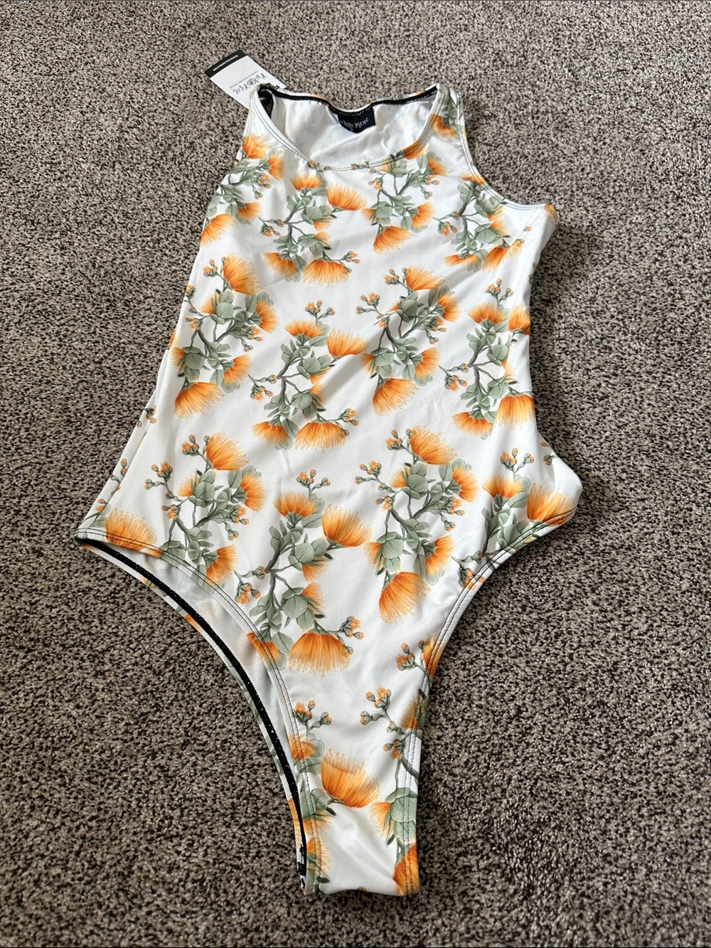 Kalokini white and orange Lehua Mamo print bodysuit
